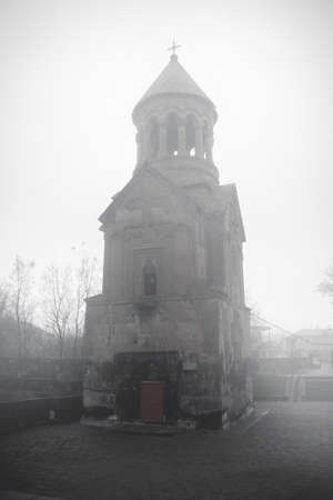 Ancient Armenian church in the fogの写真素材