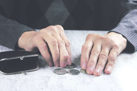 Senior woman counting coins