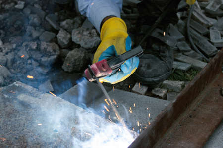 young foreman doing electrical weldingの写真素材