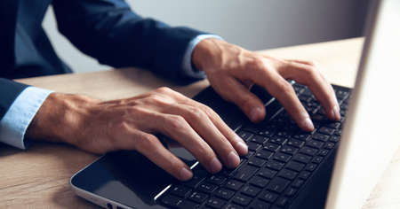young man works with computerの写真素材