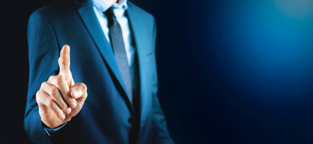 business man presses on touch screenの写真素材
