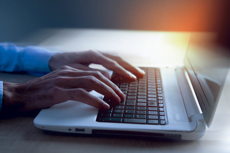 young man works with computerの写真素材
