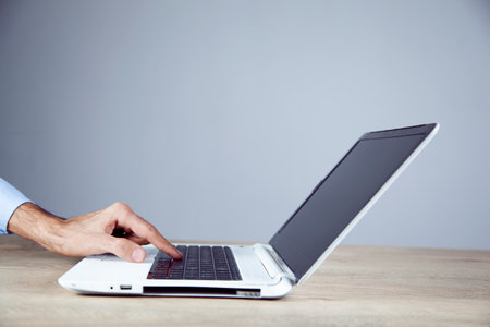 young man works with computerの写真素材