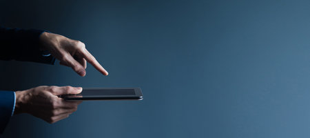 businessman holding tablet in handの写真素材