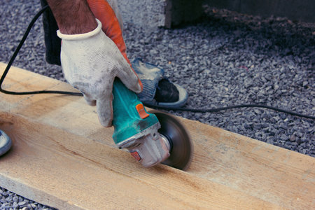Manual worker work in factory with grinderの写真素材