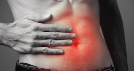 young man suffering from abdominal pain