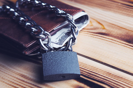 Padlock on the dollar bills. close up. business concept.