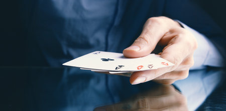 Winning poker hand of four aces playing cards