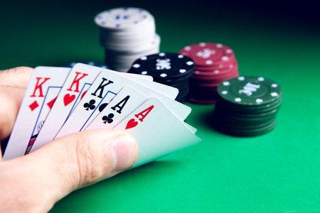 Gambling .Close-up cards for playing poker on a gaming table in a casino