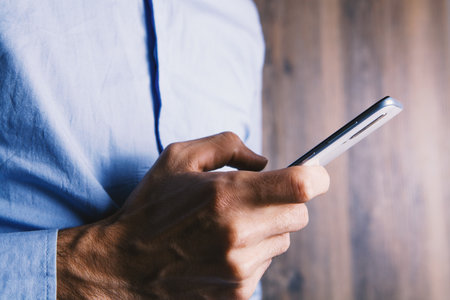 man using his mobile phoneの写真素材