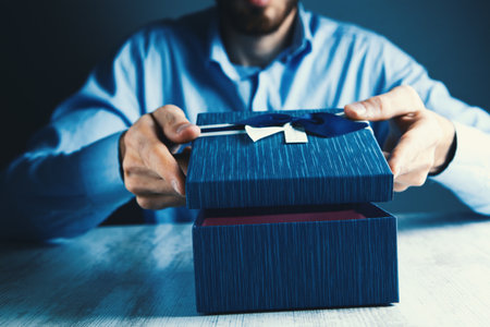 man holding a gift in his handの写真素材