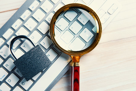 Keyboard with lock and magnifying glassの写真素材