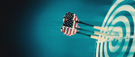 dart arrow hitting in the target center of the dartboard.の写真素材