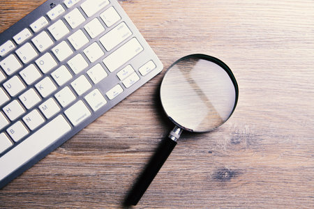 Internet search concept, magnifier and computer keyboardの写真素材