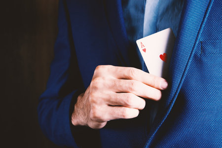 man holding a playful card