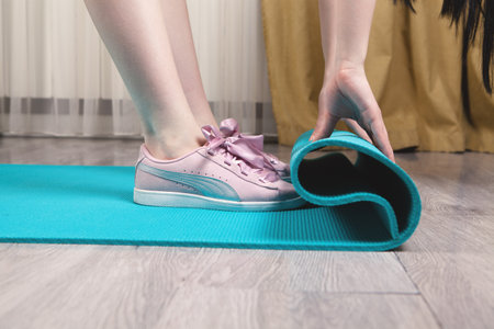 Close up of sporty woman folding yoga