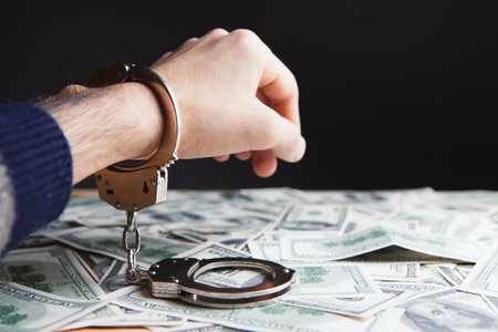 money and handcuffs bribery of the authorities