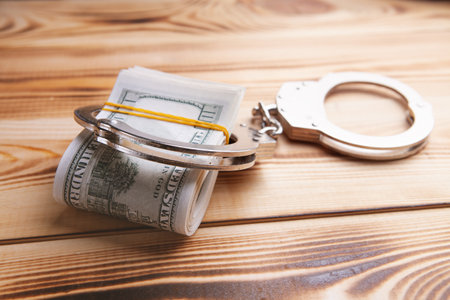 money and handcuffs bribery of the authoritiesの写真素材