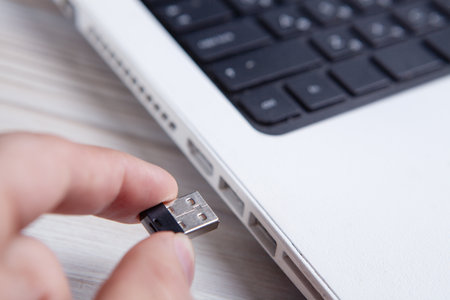 Modern USB drive on laptop keyboard