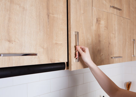 girl opens the kitchen door furniture