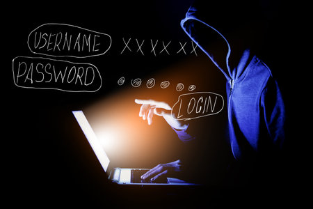 hacker with laptop. computer crime.の写真素材