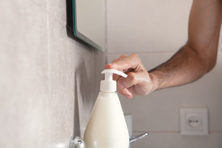 Close up of man wash hands in sink in the morning