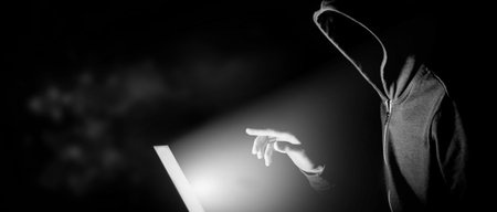 Cybersecurity, computer hacker with hoodieの写真素材