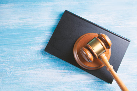 Wooden judge gavel and law books.の写真素材