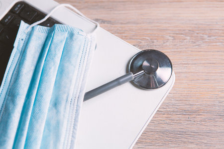laptop medical mask and stethoscope