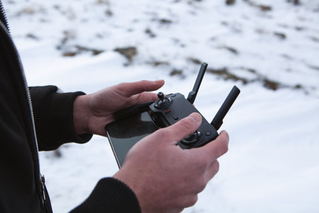 Point of view shot of man holding remote control with hands