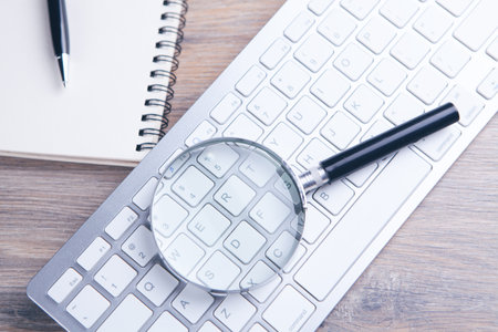 Internet search concept, magnifier and computer keyboardの写真素材