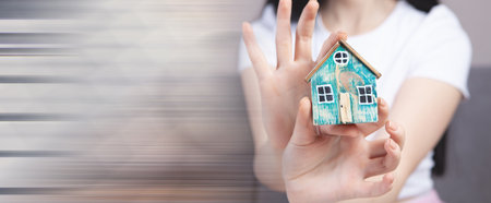 girl holding a model at homeの写真素材