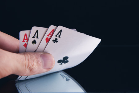 Winning poker hand of four aces playing cardsの写真素材