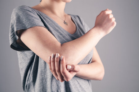 joint injuries. Spasm on the girl's arm.の写真素材