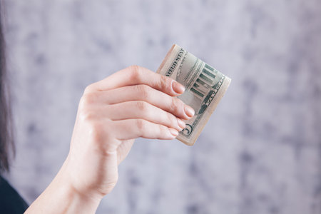 girl holding big money in her hands