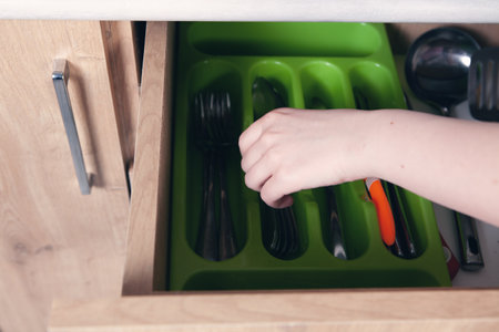 hand holding kitchen doorの写真素材