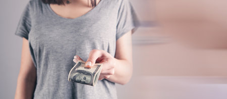 girl holding big money in her hands