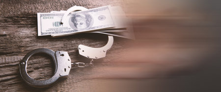 money and handcuffs bribery of the authorities