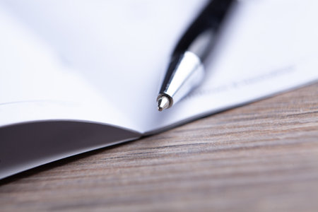 glasses with pen close up and financial report - accounting conceptの写真素材