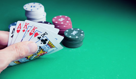 Gambling .Close-up cards for playing poker on a gaming table in a casinoの写真素材