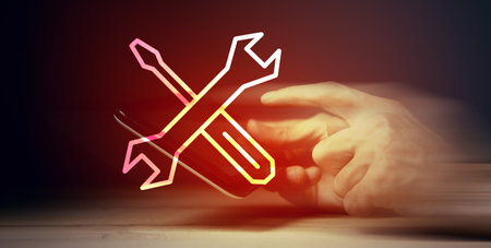 man presses on a screwdriver and wrench. technical supportの写真素材