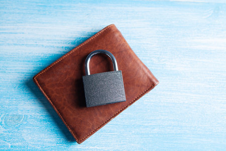 lock on a leather wallet on the table
