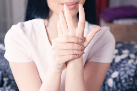 a young woman has a sore palmの写真素材