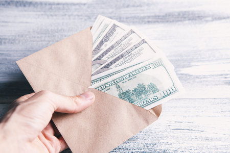 money in a brown envelope