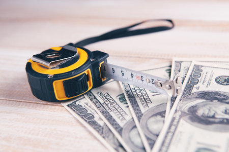 building meter and money on the tableの写真素材