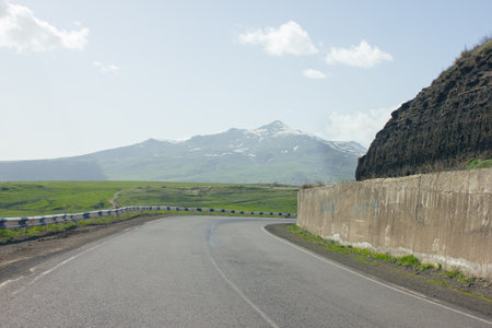 asphalt road and fence in the open area