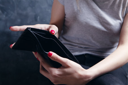 young girl showing empty wallet
