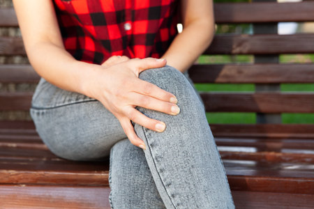 girl sitting on a benchの写真素材