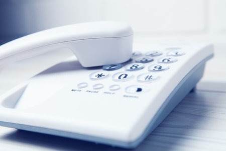 white home phone on the table