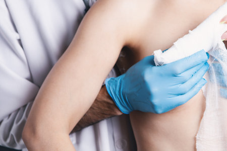 the doctor wraps the bandage around the chestの写真素材